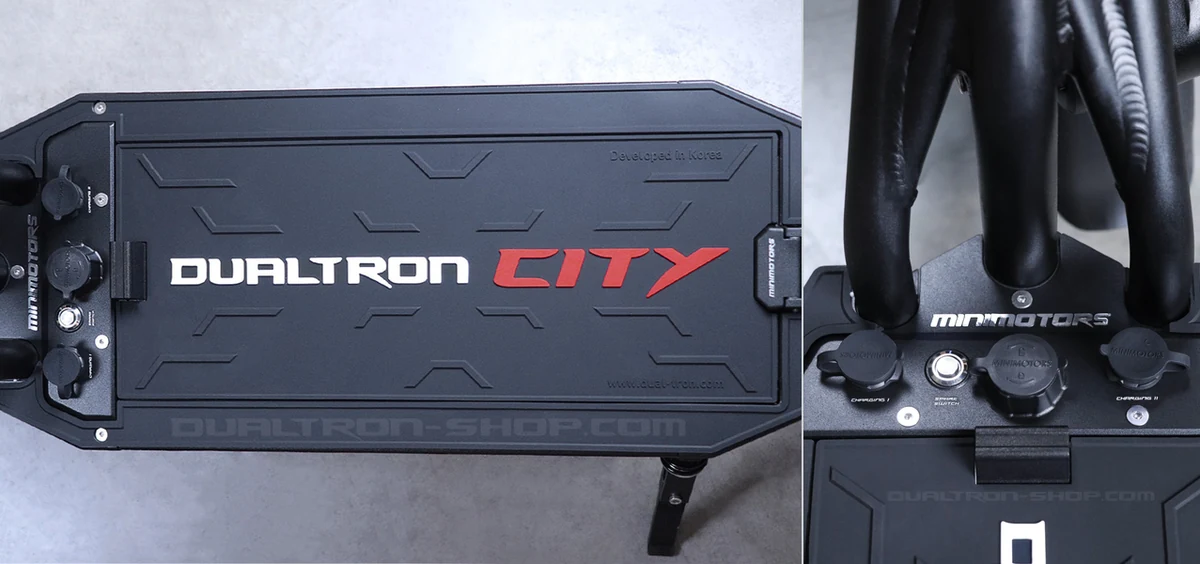 Dualtron City deck shown horizontally beside the original charging socket photograph