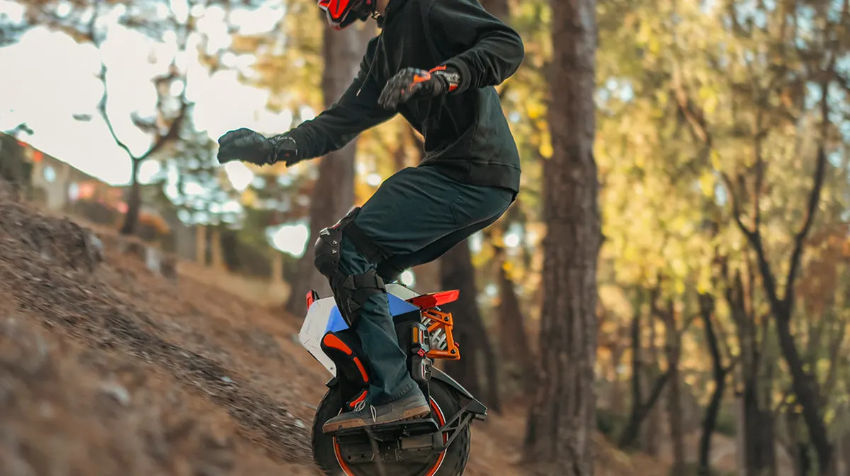 INMOTION V14 Pro rider demonstrating high-performance terrain capability