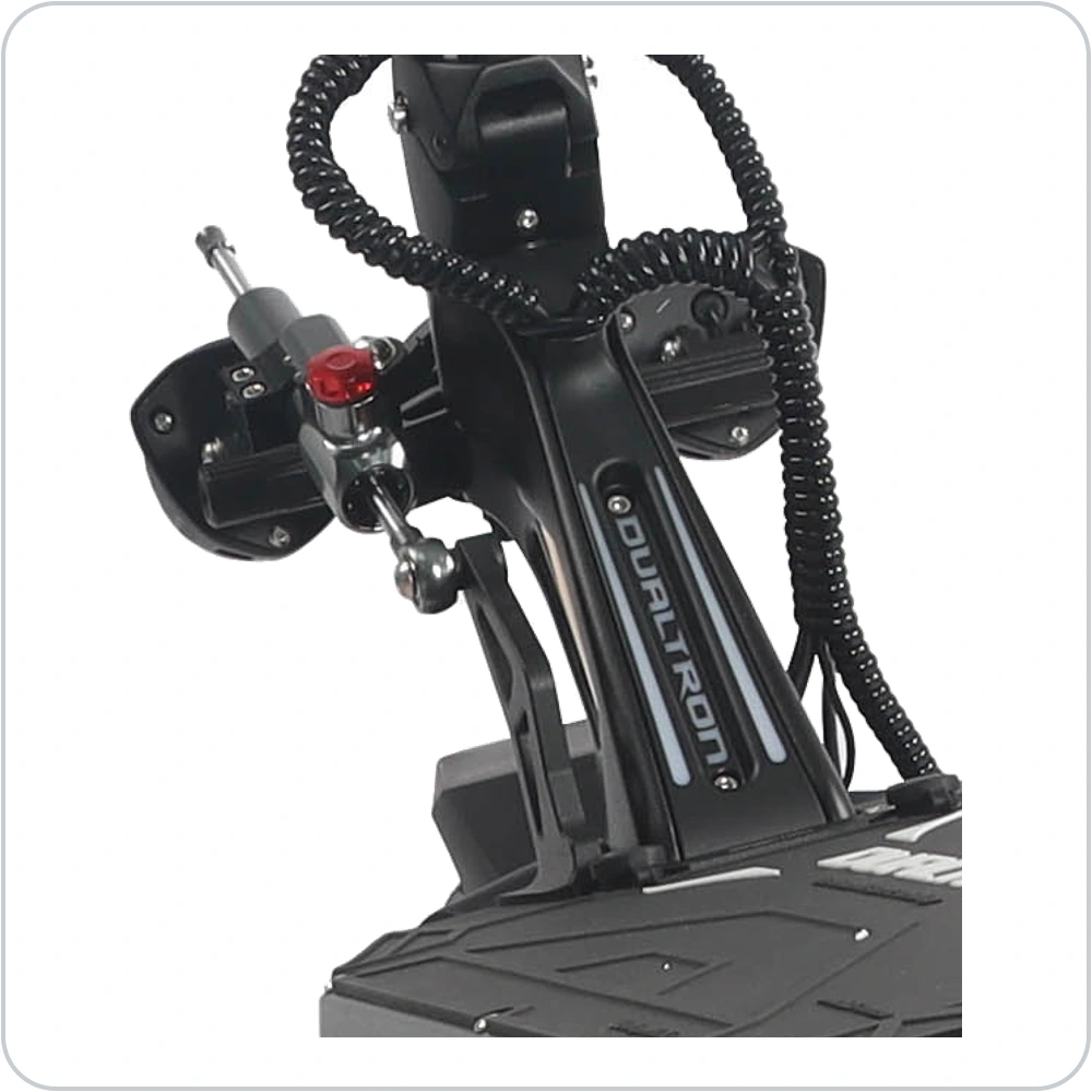 Included directional steering damper with silver rod, adjustment knob and mounting hardware