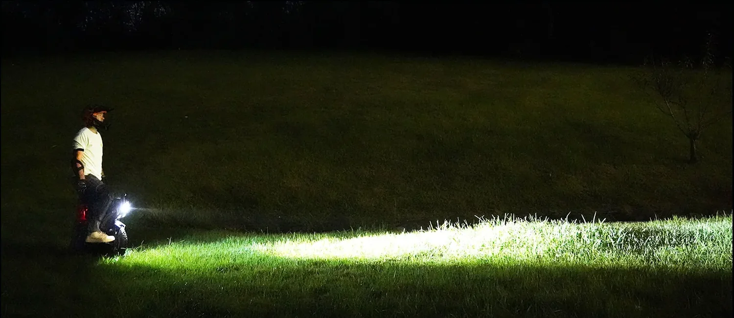 INMOTION X1 headlight illuminating the full trail